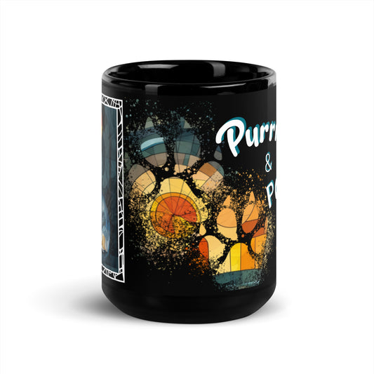 Purrr & Pour text with image of a Tuxedo cat on stained glass style background with colorful paw prints on a black ceramic mug 15 oz — front view