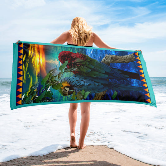 Love Birds geometric pattern on a Color in Motion beach towel 30x60 — woman walking on beach with towel flowing behind her