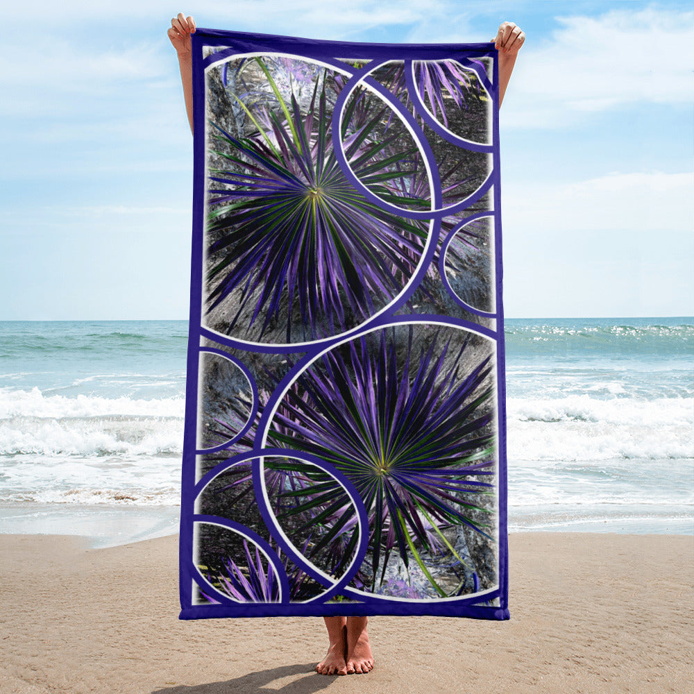 Wild Palm geometric pattern on a Color in Motion beach towel 30x60 — person on beach holding towel lengthwise