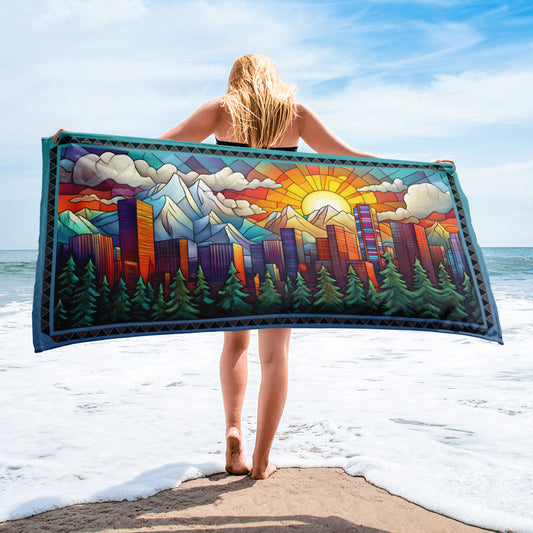 City On The Hill geometric pattern on a Color in Motion beach towel 30x60 — woman walking on beach with towel flowing behind her