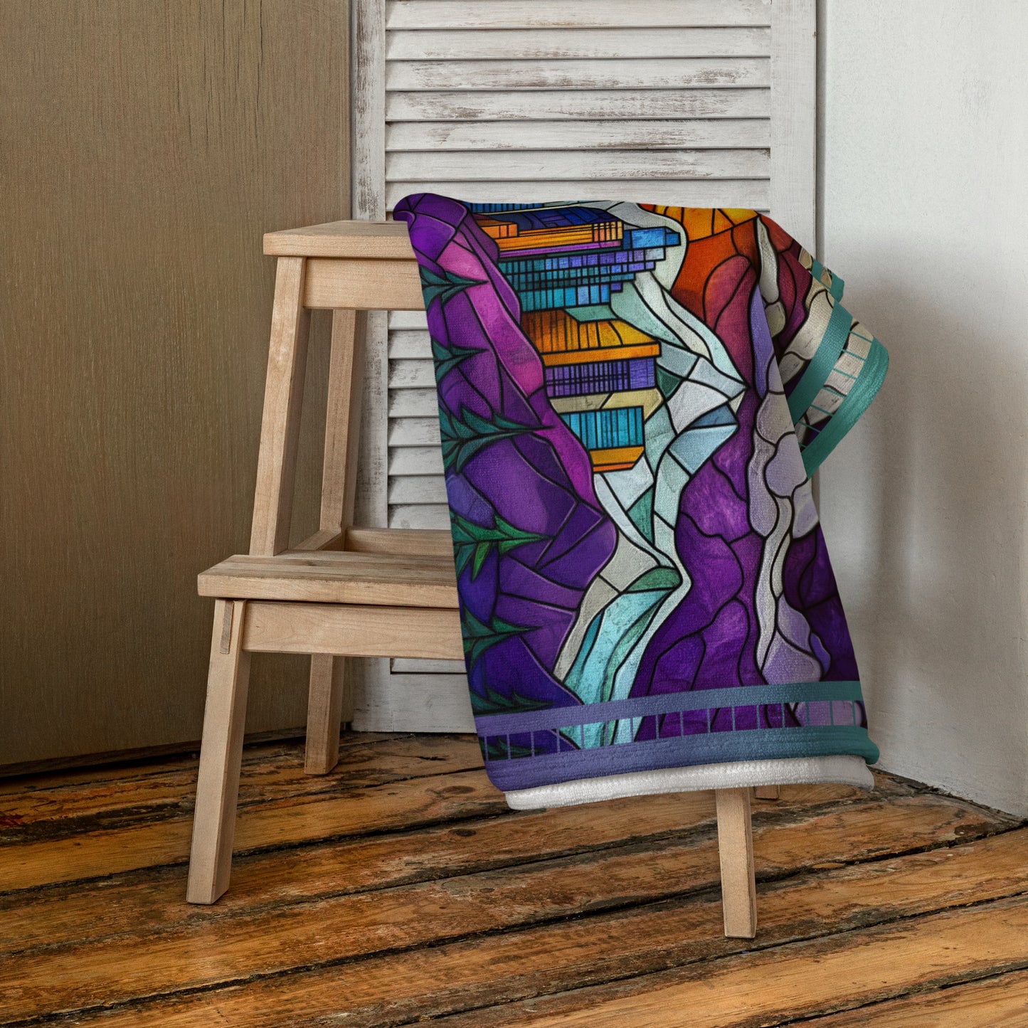 Summit Glow geometric pattern on a Color in Motion beach towel 30x60 — folded and draped over wooden stool
