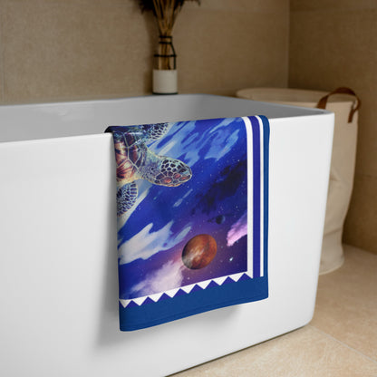 Lunar Waves geometric pattern on a Color in Motion beach towel 30x60 — folded and hanging over bathtub