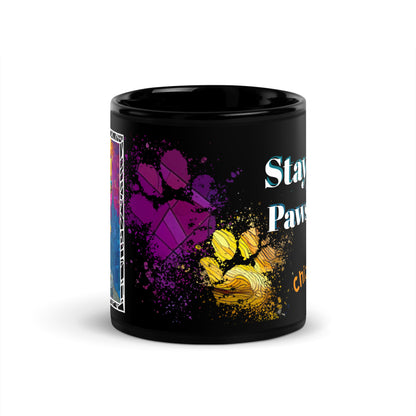 Stay Pawsitive text with image of a Chihuahua dog on stained glass style background with colorful paw prints on a black ceramic mug 11 oz — front view