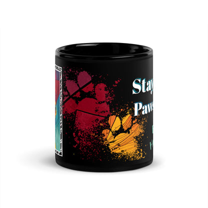 Stay Pawsitive text with image of a Fox Terrier dog on stained glass style background with colorful paw prints on a black ceramic mug 11 oz — front view