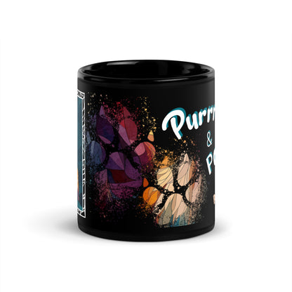 Purrr & Pour text with image of a Ragdoll  cat on stained glass style background with colorful paw prints on a black ceramic mug 11 oz — front view