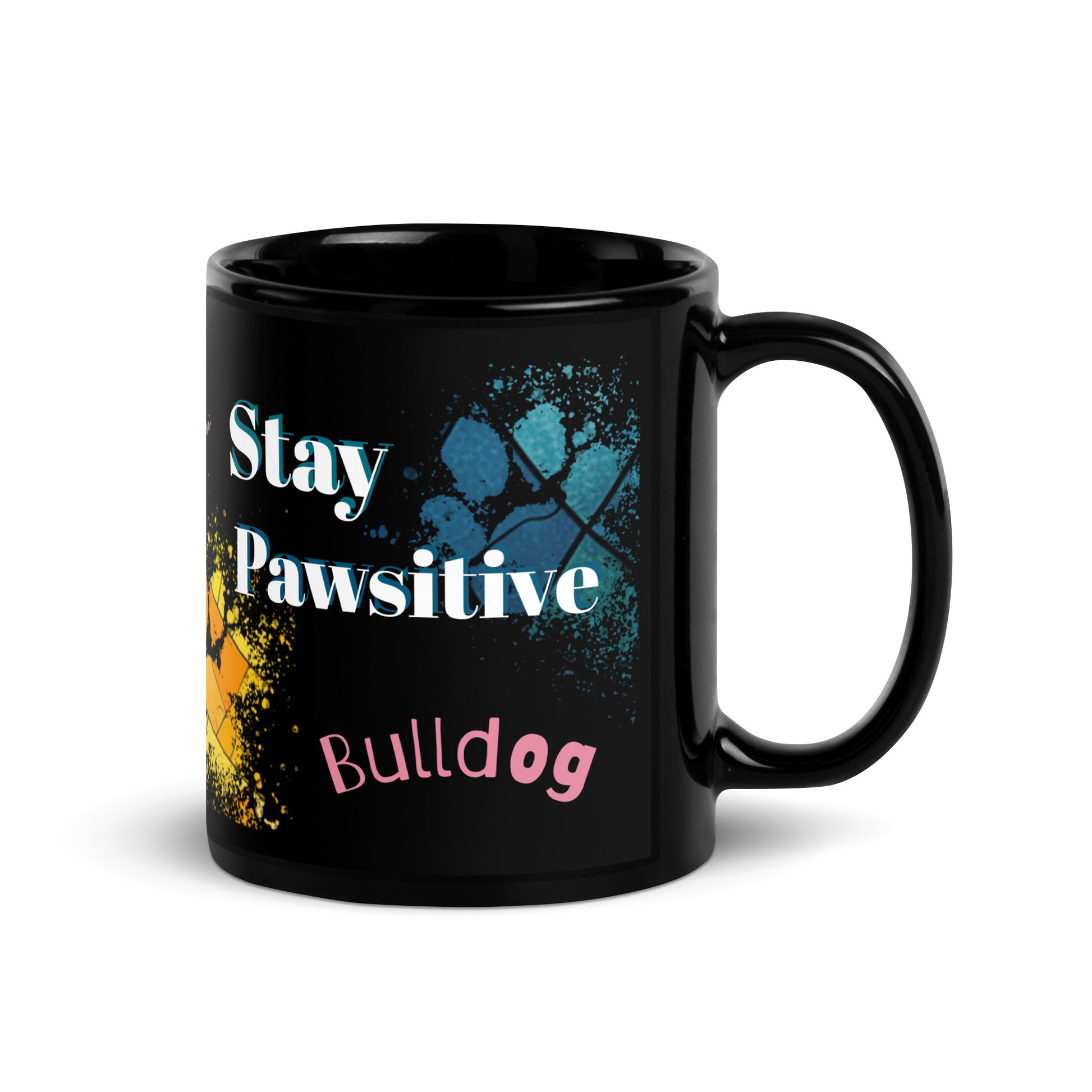 Stay Pawsitive text with image of a Bulldog on stained glass style background with colorful paw prints on a black ceramic mug 11 oz — handle on right