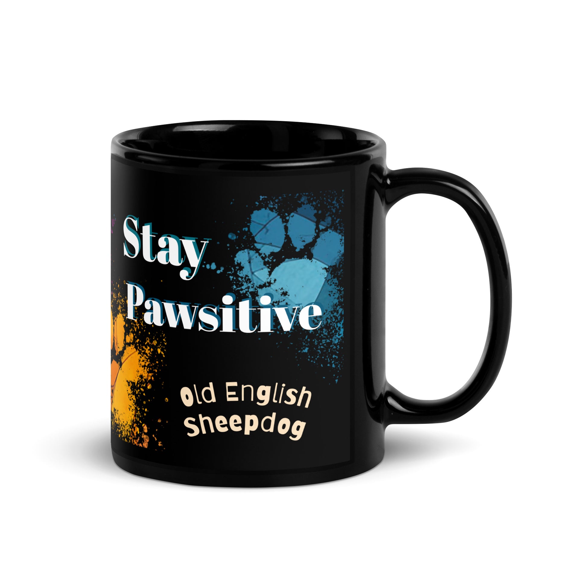 Stay Pawsitive text with image of a Old English Sheepdog dog on stained glass style background with colorful paw prints on a black ceramic mug 11 oz — handle on right