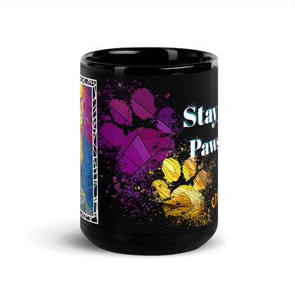Stay Pawsitive text with image of a Chihuahua dog on stained glass style background with colorful paw prints on a black ceramic mug 15 oz — front view