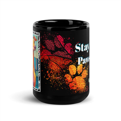 Stay Pawsitive text with image of a Greyhound dog on stained glass style background with colorful paw prints on a black ceramic mug 15 oz — front view