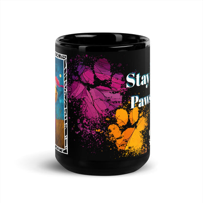 Stay Pawsitive text with image of a Old English Sheepdog dog on stained glass style background with colorful paw prints on a black ceramic mug 15 oz — front view