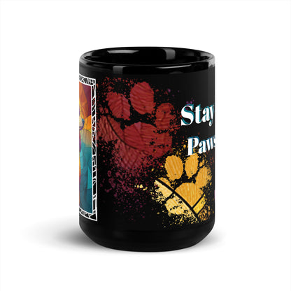 Stay Pawsitive text with image of a Poodle dog on stained glass style background with colorful paw prints on a black ceramic mug 15 oz — front view