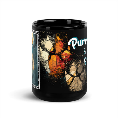 Purrr & Pour text with image of a British Shorthair cat on stained glass style background with colorful paw prints on a black ceramic mug 15 oz — front view