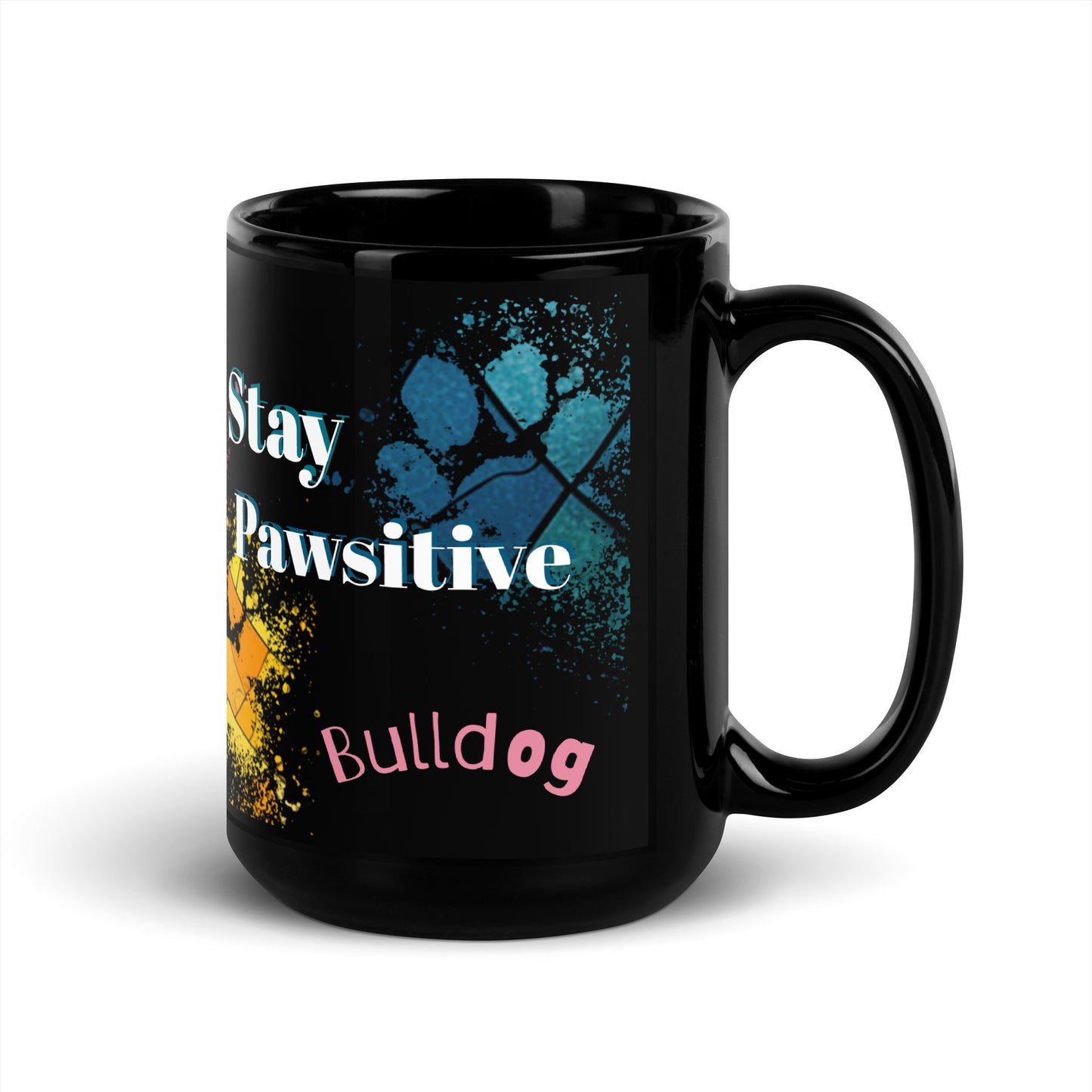 Stay Pawsitive text with image of a Bulldog on stained glass style background with colorful  paw prints on a black ceramic mug 15 oz — handle on right