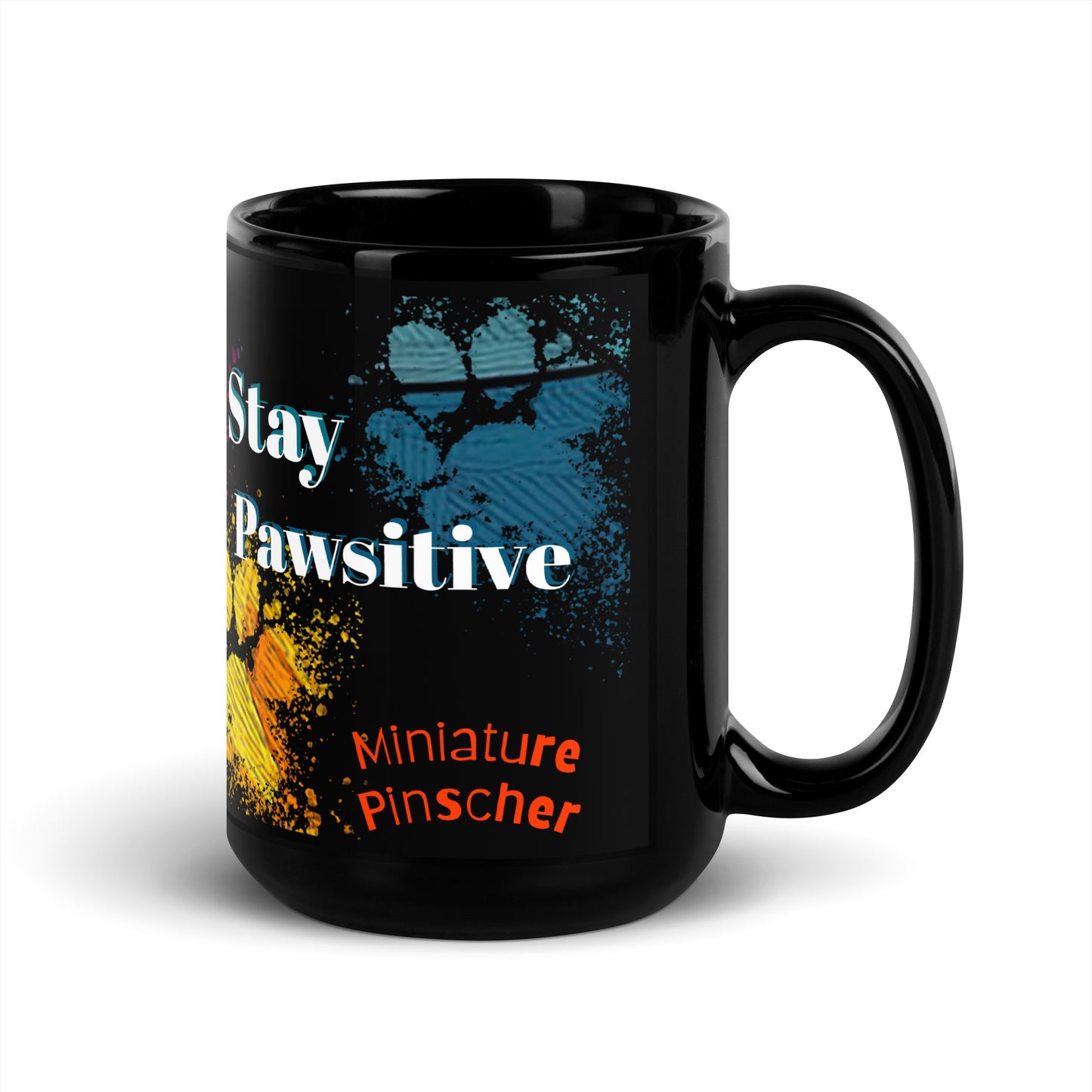 Stay Pawsitive text with image of a Miniature Pinscher dog on stained glass style background with colorful  paw prints on a black ceramic mug 15 oz — handle on right