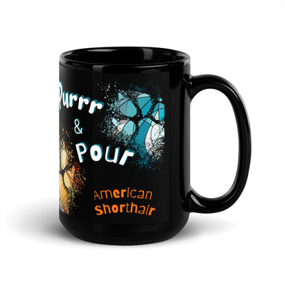 Purrr & Pour text with image of an American Shorthair cat on stained glass style background with colorful  paw prints on a black ceramic mug 15 oz — handle on right