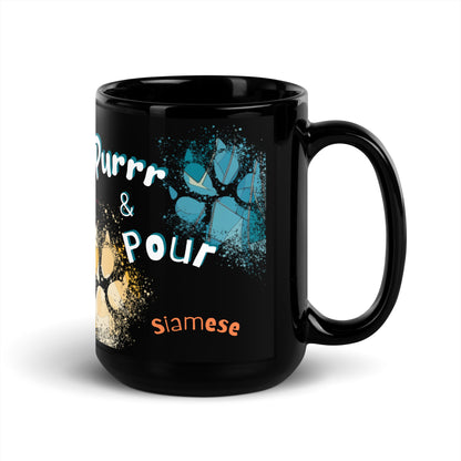 Purrr & Pour text with image of a Siamese  cat on stained glass style background with colorful  paw prints on a black ceramic mug 15 oz — handle on right