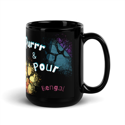 Purrr & Pour text with image of a Bengal cat on stained glass style background with colorful  paw prints on a black ceramic mug 15 oz — handle on right